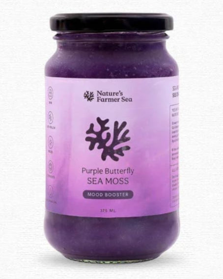 Purple jar of Purple Butterfly Sea Moss with a black lid on a white background