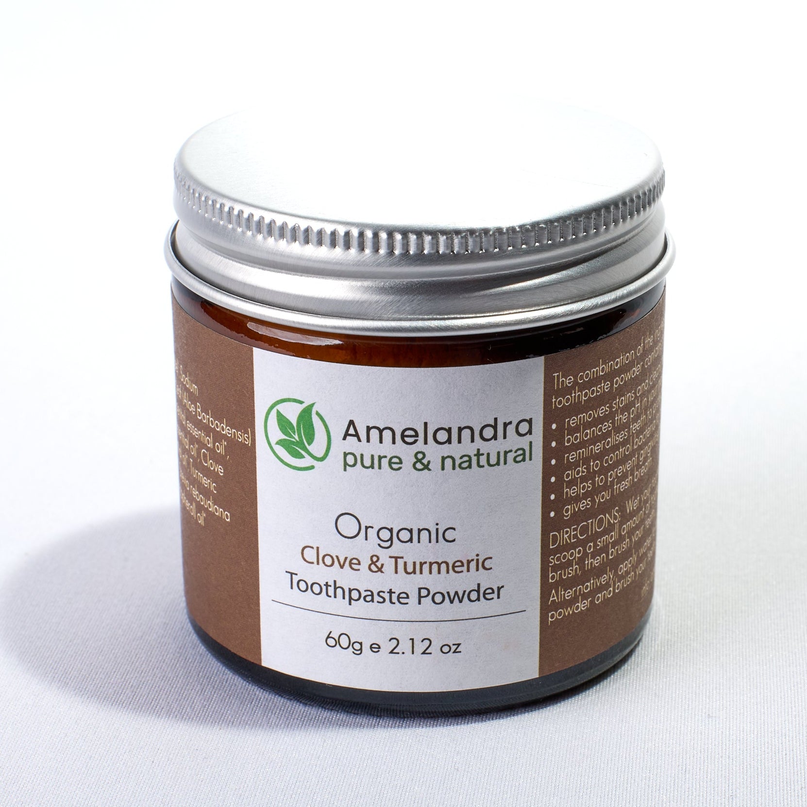 Amelandra organic clay and turmeric toothpaste powder jar on a white background