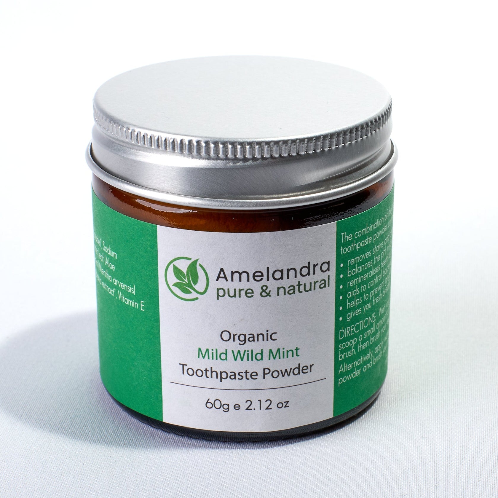 Amelandra organic toothpaste powder jar on a white background