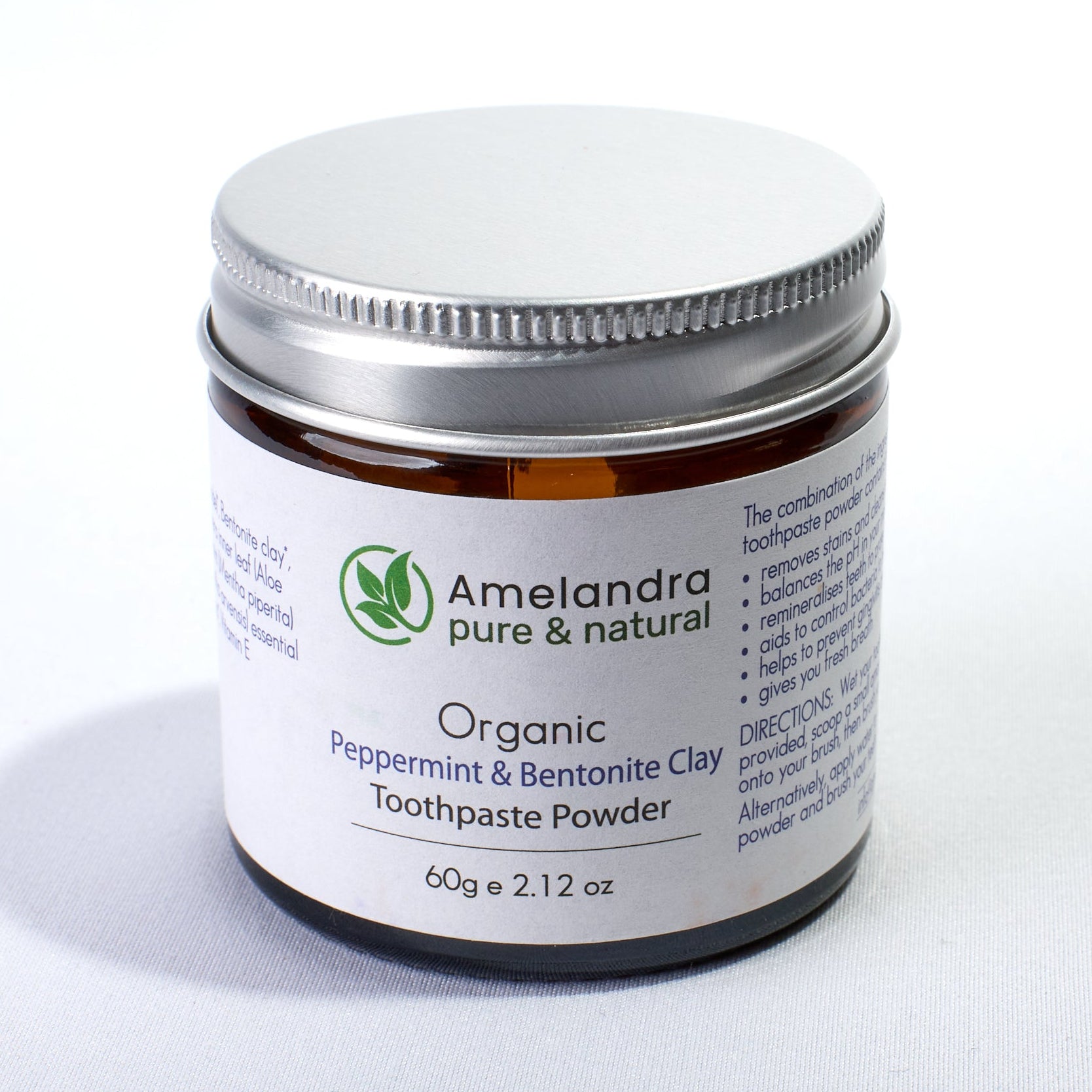 Amelandra organic peppermint and bentonite clay toothpaste powder jar on a white background