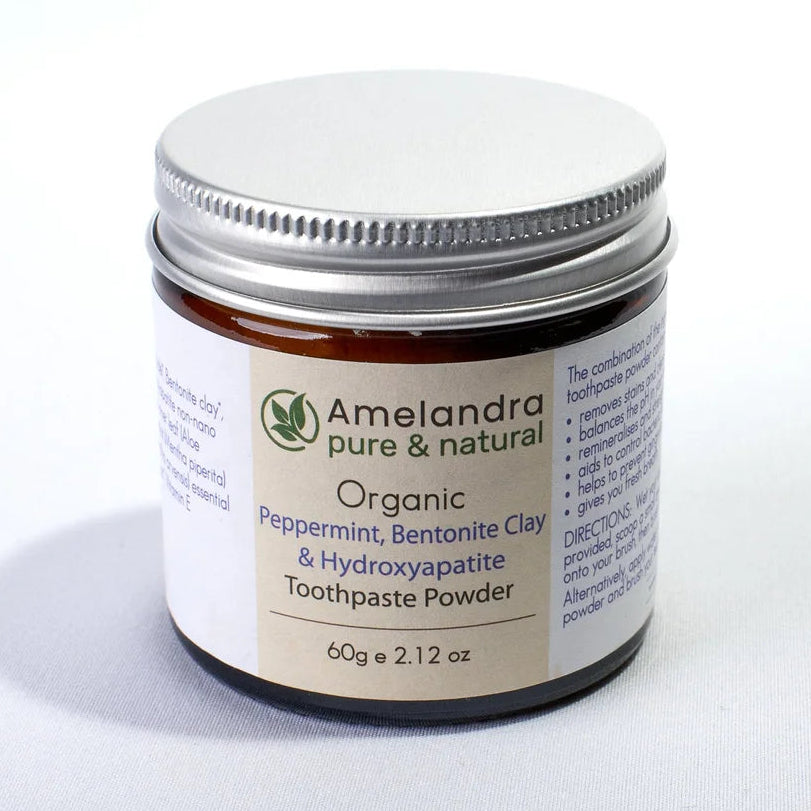 Amelandra toothpaste powder jar on a white background
