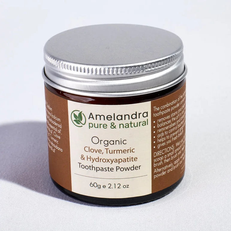 Amelandra organic toothpaste powder jar on a white background
