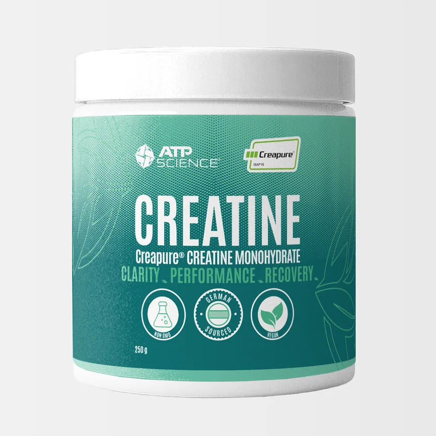 A white plastic tub of ATP Science Creatine with a teal-green label, shown against a light gray background with a Creapure brand logo in the top right corner.