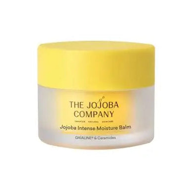 A jar of The Jojoba Company Jojoba Intense Moisture Balm with a bright yellow lid and a frosted white container, shown against a plain white background.